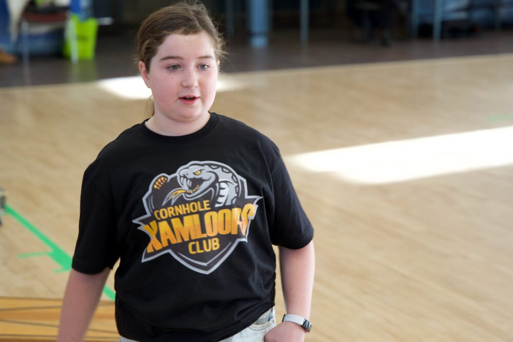 Young player at a Fraser Valley Cornhole event